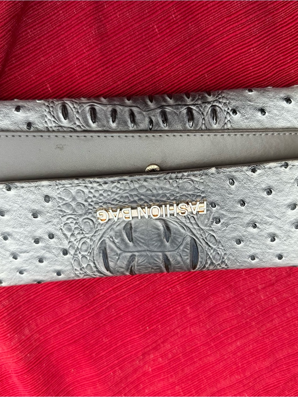 Fashion Bug Black Ostrich-Embossed Clutch with Gold Logo